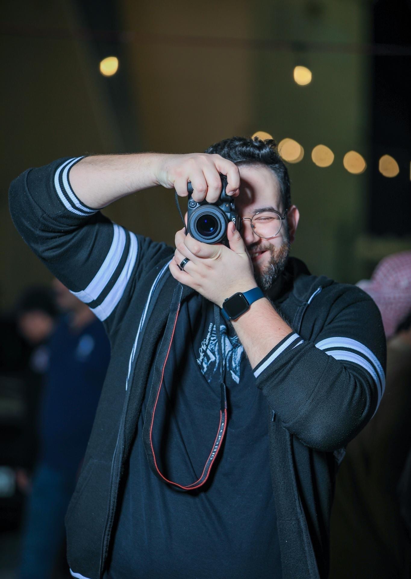 Photographer holding camera